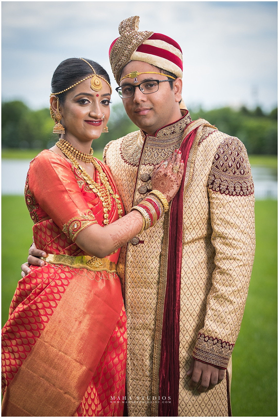 Bride in Traditional South Indian Wedding Saree standing next to Groom