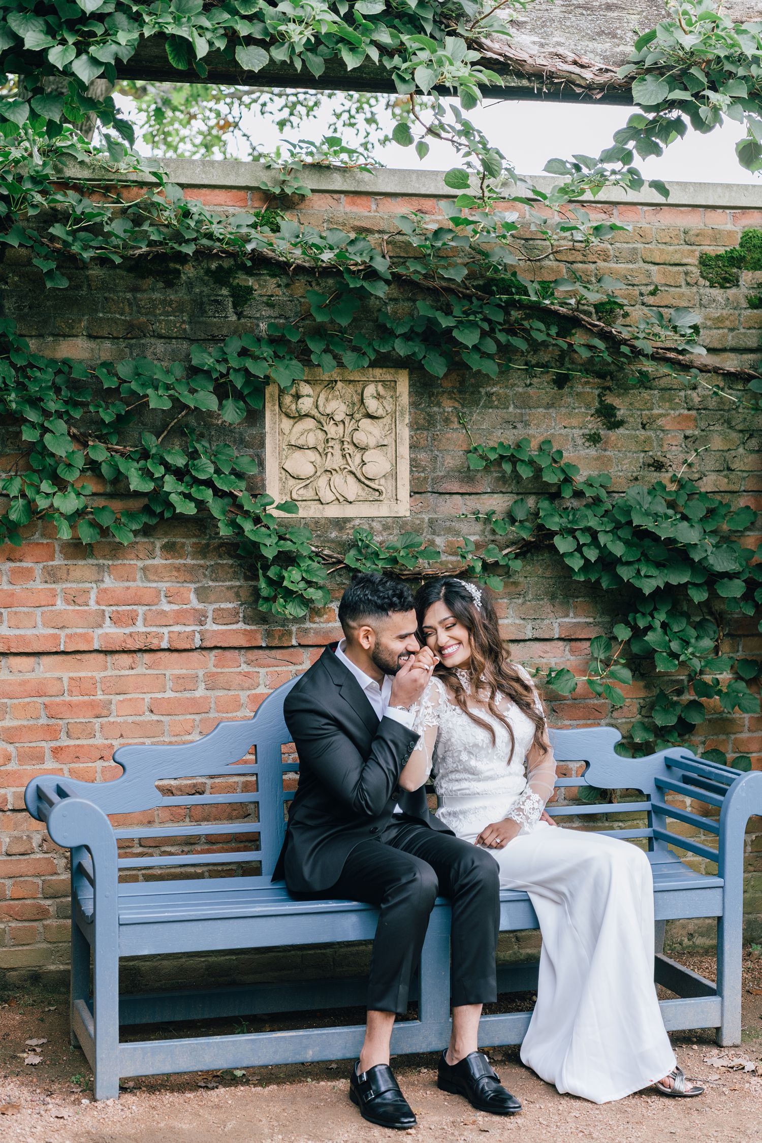Wedding couple at Chicago Botanic Garden sitting in Walled English Garden