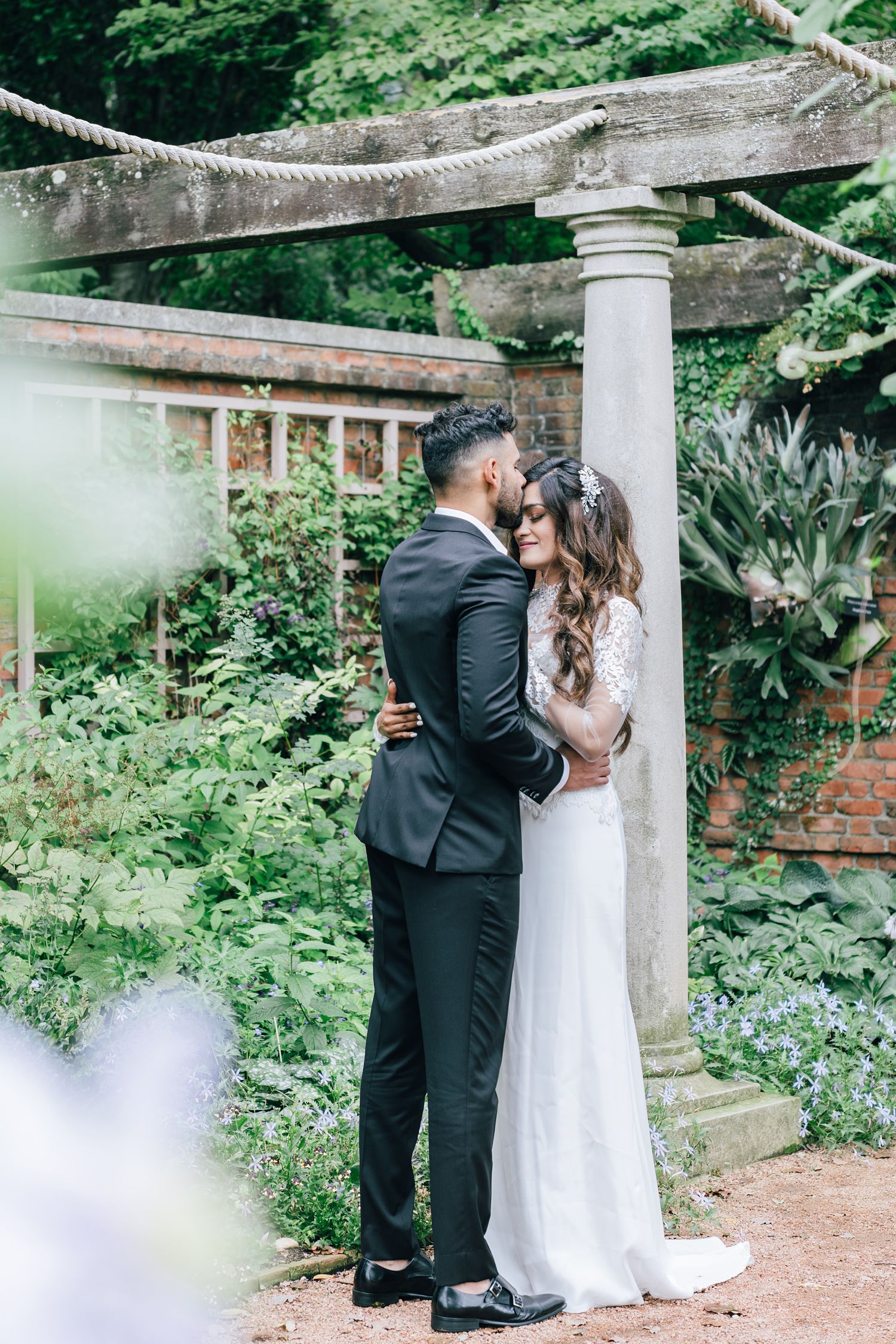 Kissing Wedding couple at Walled English Garden