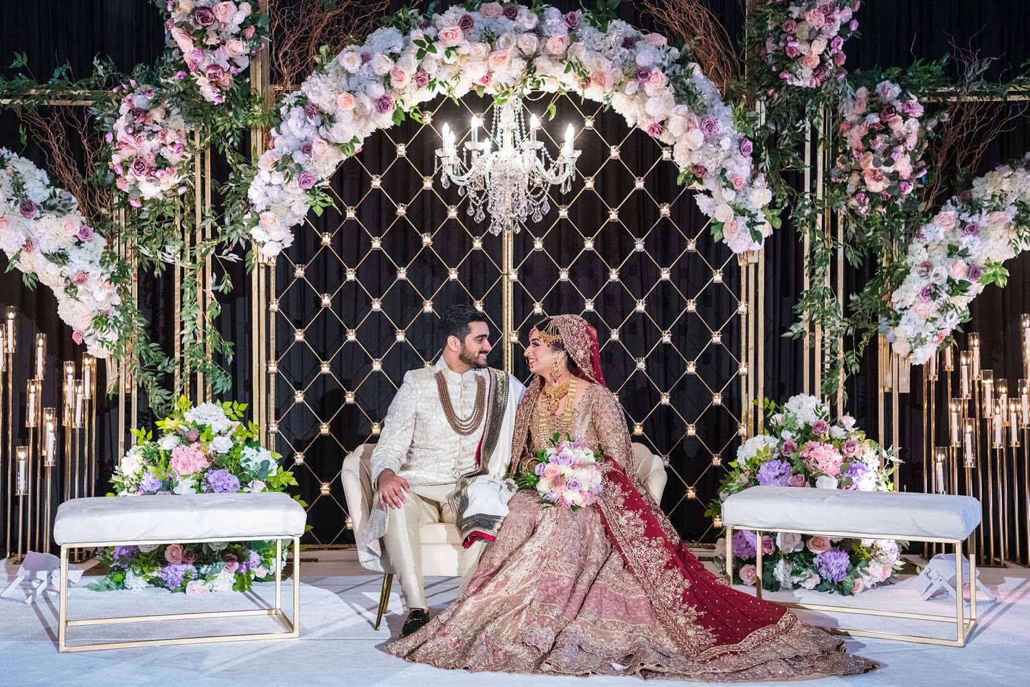 Indian wedding couple in grand ballroom of Hilton Chicago by Maha Studios