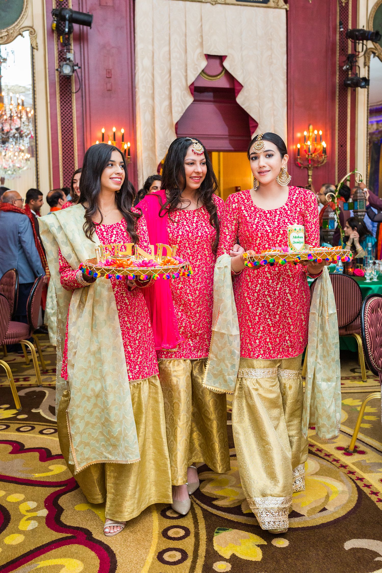 Candid Mehndi Party photo of ladies entering at Palmer House wedding. Photographed by Maha Studios 