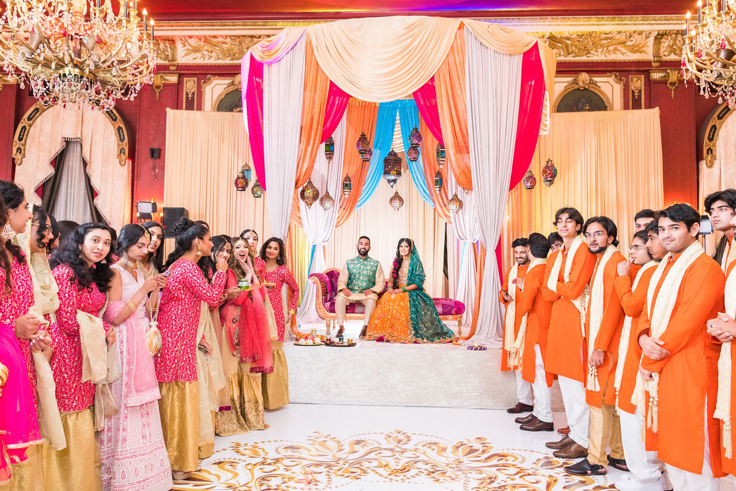 Pakistani Bride and Groom at Mehndi Party with their friends and family at Palmer House wedding. Photographed by Maha Studios